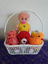 Doll and toys on basket