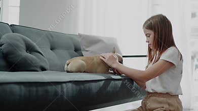 Caring Teenager Feeds Her Puppy.
