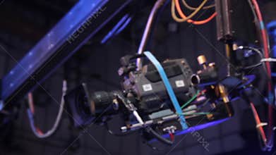 A crane with a camera on a suspension in a TV studio during a tv broadcast