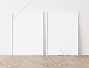 Set of 2 white frames a3, a4, frame mock up on white wall standing on wooden floor.