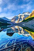 Summer staycation discovery at Consolation Lake with visible glacier on Mount Quadra, Alberta, Canada