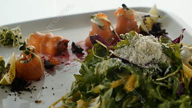 Gourmet food, Appetizer on white plate close up. Delicious delicacy.