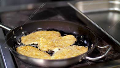 Cooking. close-up. chicken chop fried in a pan. health food. volunteering and charity. reopening . safety concept.