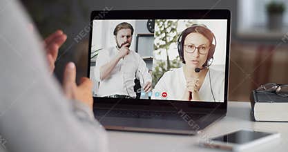 Company members having video chat on laptop at home