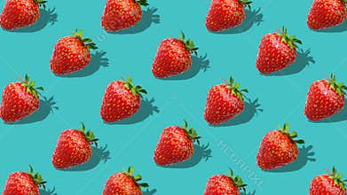Flat lay composition with strawberry berry on cyan background