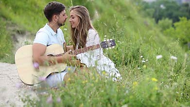 Young Couple In Love At Romantic Date In Nature