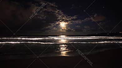 Full moon rising over sea waves. Dramatic sunset over beach video