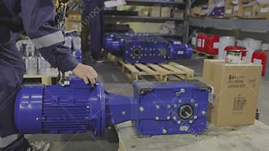 Gearbox assembly process. Gearboxes assembly at the factory. Gear motors manufacturing