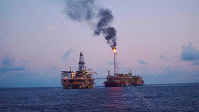 FPSO tanker vessel near Oil Rig platform. Offshore oil and gas industry