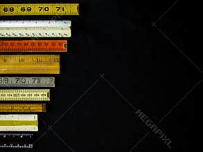 Metric and inch rulers and scales form a business or finance chart indicating measurement, precision, accuracy.