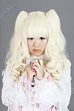 Portrait of japanese cosplayer wearing pink dress