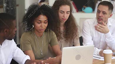 African female mentor teach diverse employees explain computer work