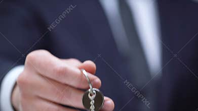 Luxury word on keychain in reach person hand, expansive lifestyle, concept