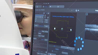 A young woman undergoes an ophthalmological examination, checking the health of the eyes and visual acuity.