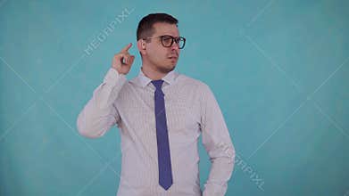 Portrait man with hearing impairment with a hearing aid on a blue background
