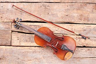 Old violin and fiddle stick.