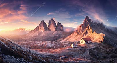 Mountain valley with beautiful house and church at sunset