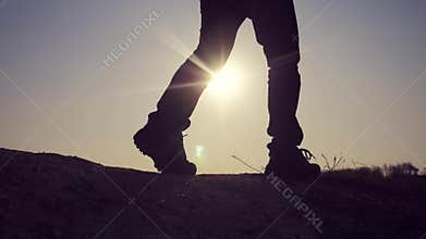 Teamwork business travel concept. Legs silhouette group hikers of people walking on lifestyle the top of the mountain