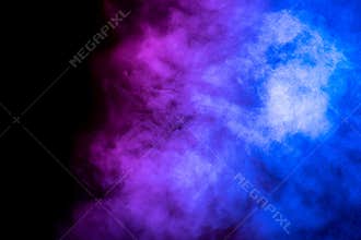 Bright blue and purple smoke isolated on black background