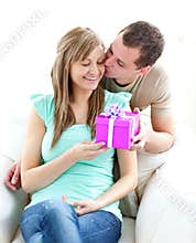 A boyfriend giving a present to his girlfriend