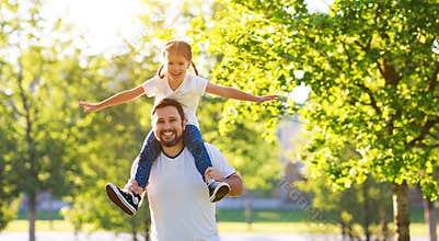 Concept of father`s day! happy family dad and child daughter    in nature