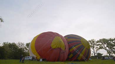 KAMIANETS-PODOLSKYI, UKRAINE, 17.05.2019 Inflating hot air baloons before sunrise at the annual
