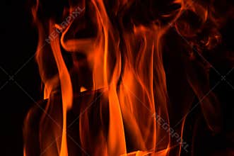 Close up. Abstrack background. Orange flames in the fireplace. Copy space