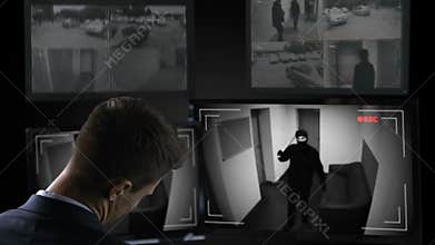Male security guard sleeping in front of CCTV footage, bandit brake in building