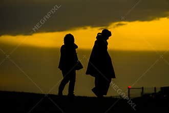 Those who stand in the hills of the fall of dusk