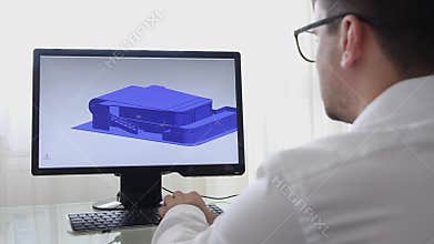 Engineer, Constructor, Designer, Architect in Glasses Working on a Personal Computer. He Creating New Design of Building