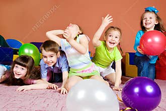 Kids playing with balloons