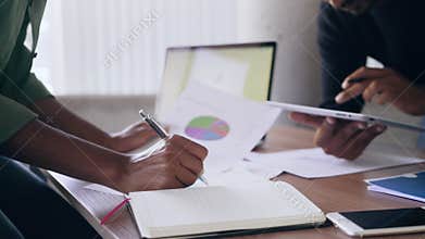 Business people analyzing data in board room at office