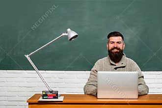 Teachers day. Knowledge day. Student working on laptop in college. Students preparing for university exams.