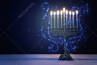 Religion image of jewish holiday Hanukkah background with menorah traditional candelabra and candles
