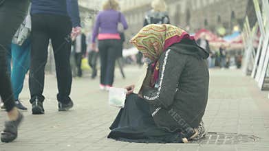 Beggar homeless woman. Poverty. Vagrancy. Kyiv. Ukraine.