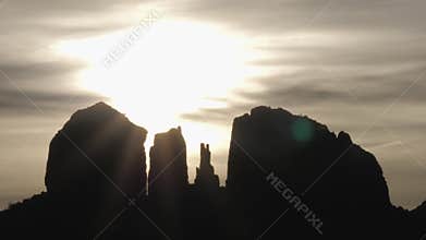 Mystical Sun and Clouds Behind Sedona Rock Formations Slow Pan Time Lapse
