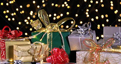 Christmas gifts near Christmas tree and atmospheric lights