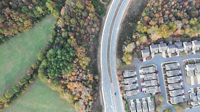 Aerial 4k Top to bottom of Atlanta suburbs showing houses and new developments with cars passing by