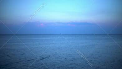 Sea concept view: big city seafront beach landscape scenery, blue sea with military and fishing ships on horizon 4k