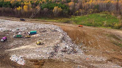 Trash from household waste. Garbage trucks carry garbage to a landfill, top view.
