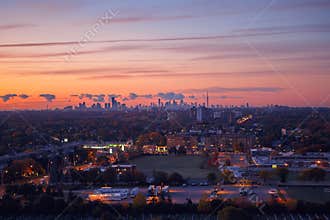 morning sky clouds in Toronto city, Canada. Rays of early rising sun. Landscape aerial top view with urban street.