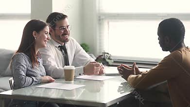 HR managers and african unemployed male talking during job interview