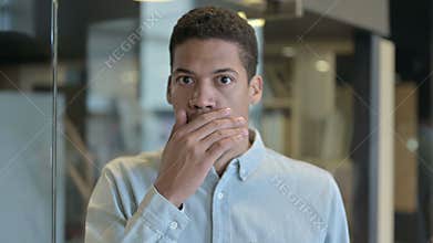 Shocked Young African Man Wondering in Awe