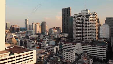 Thailand Bangkok aerial drone shot cityscape and downtown birdseye, panning around tower and transportation intersection