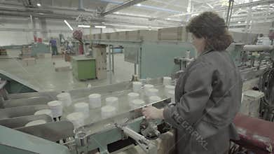 Work on the conveyor in a paper mill. Technology. Factory. Kyiv. Ukraine