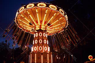 Carousel Merry-go-round in amusement park at a night city