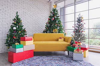 Christmas living room, Yellow sofa with Christmas trees and Christmas decorations