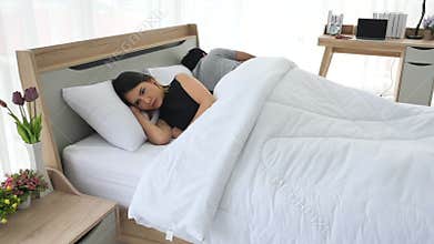 Couple in bedroom with problem in relationship.