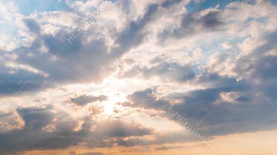 Timelapse: sun beams shining through moving dramatic white clouds - hope concept