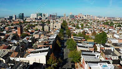 Wide aerial perspective over streets and neighborhoods of Baltimore Maryland